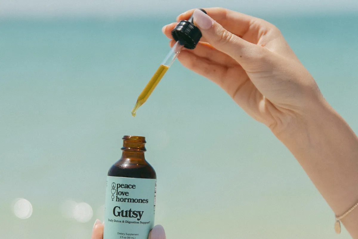 Peace Love Hormones tincture at the beach